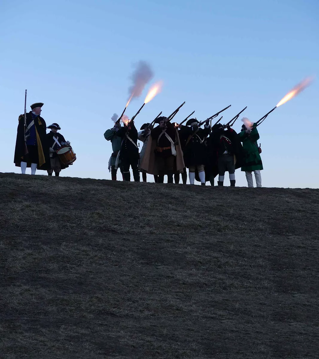The-Acton-Minutemen-fore-a-volley-from-the-hill-at-NARA-Park-Winter-Carnival-2017.jpg