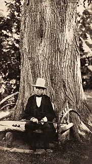 Bronson-Alcott-on-bench-with-apples-courtesy-LMA's-orchard-house.jpg